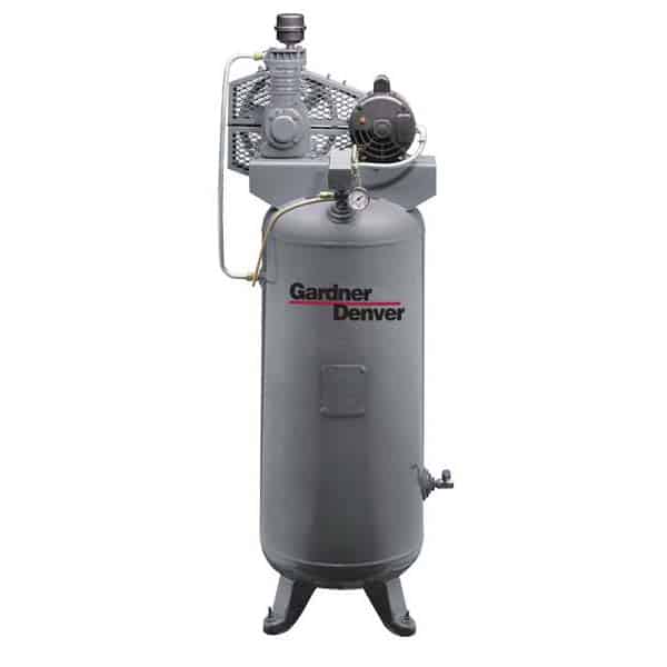A vertical Gardner Denver air compressor featuring a gray cylindrical tank, pressure gauge, and top-mounted motor on three sturdy legs.