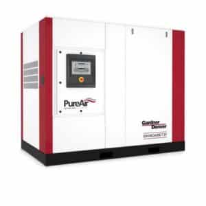 A large industrial air compressor unit with a digital control panel, labeled PureAir and Gardner Denver ENVIROAIRE T 37, featuring white and red panels.