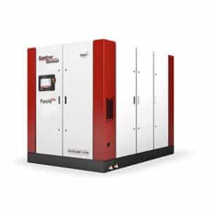 A large industrial air compressor with a red and white exterior labeled Gardner Denver PureAir, control panel on the front, on a black base.
