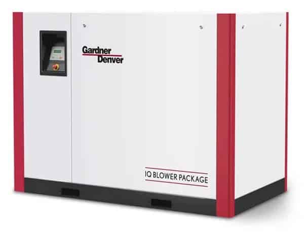 A white industrial machine with red vertical accents labeled Gardner Denver and IQ Blower Package, featuring a control panel on the left side.