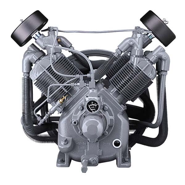 Gray V-shaped air compressor pump with black hoses, cooling fins, and a pressure gauge, seen from the front on a white background.