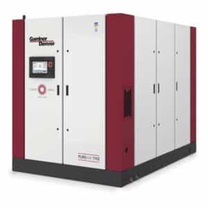 Large industrial air compressor unit with a white and red exterior, labeled Gardner Denver and PUREAIR T110, featuring a control panel with a display screen on the front.