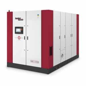 A large Gardner Denver industrial air compressor with white and red panels, control screen, and the model name PUREAIR TVS355 on the front.