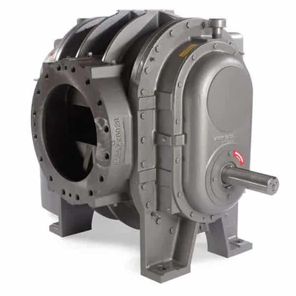 Large industrial air blower or vacuum pump with cylindrical body, visible bolts, intake opening, protruding shaft; grey on sturdy base.