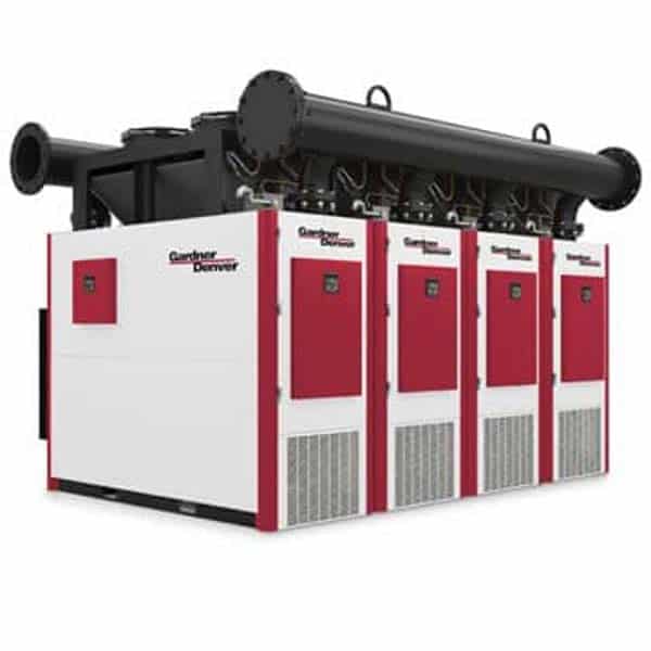 Large industrial air compressor unit with four red and white sections, labeled Gardner Denver, featuring multiple cooling vents and large black pipes on top.