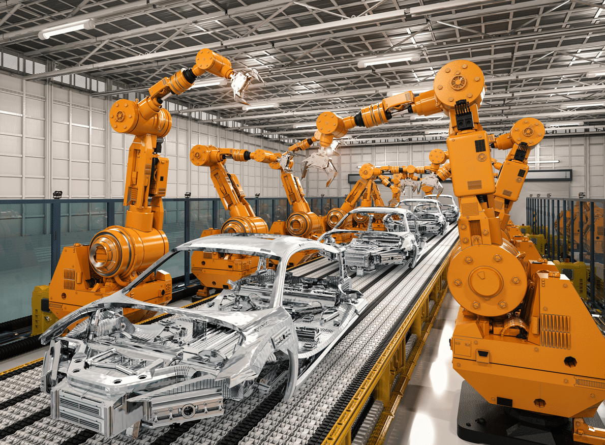 Robotic arms assemble car chassis on an automated assembly line in a brightly lit factory.