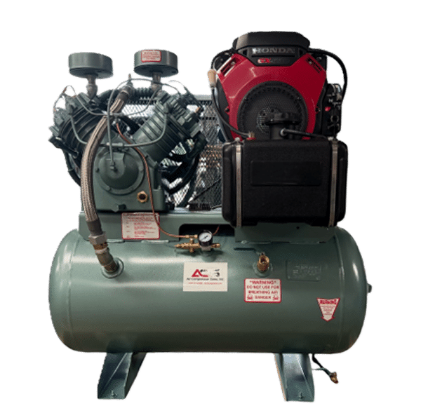 Industrial air compressor featuring a green horizontal tank, two large cylinders, gauges, hoses, safety labels, and a red-black motor on top against a plain white background.